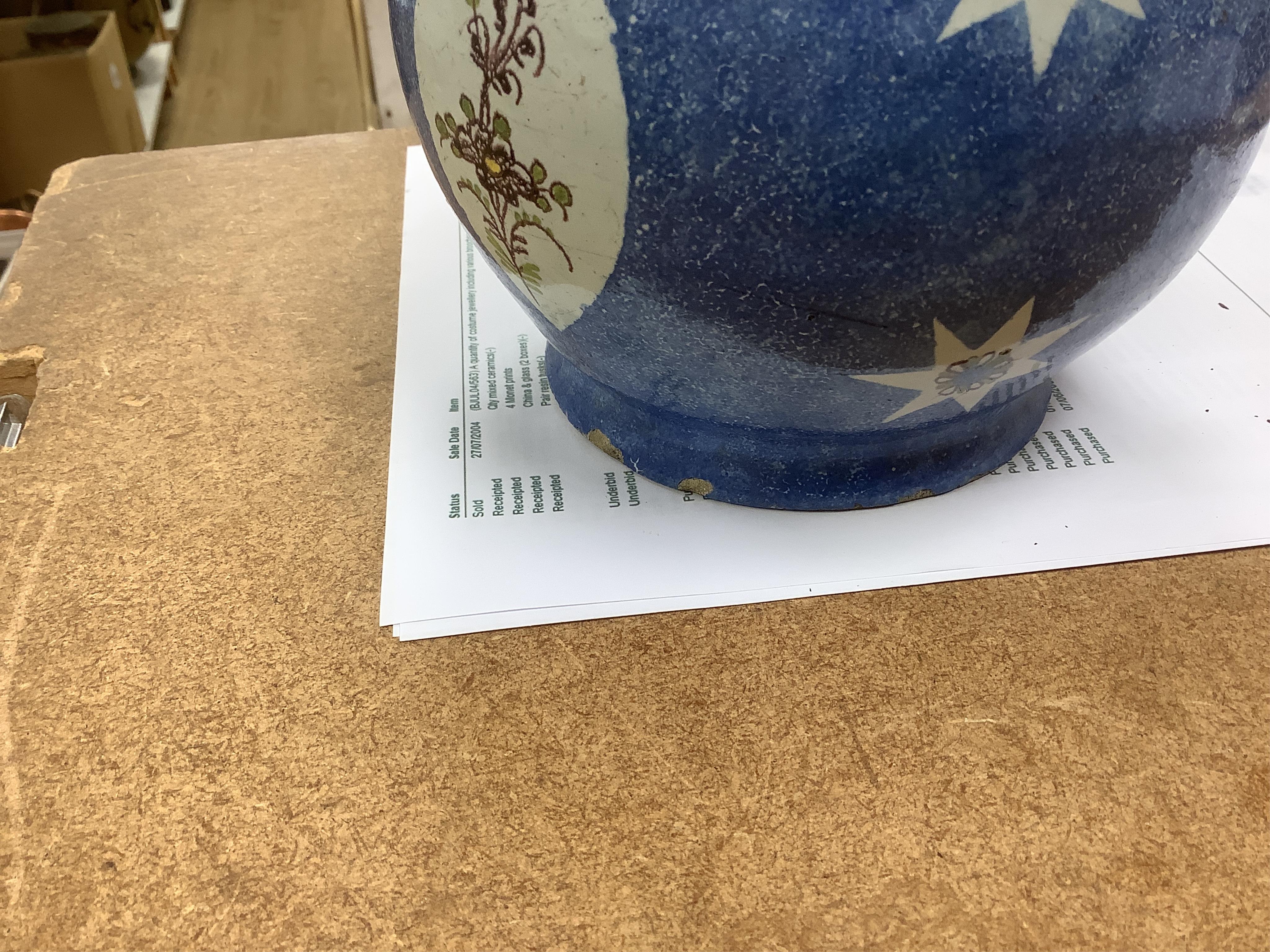 An 18th / 19th century Brussels faience jug and a French Quimper faience pottery jug, largest 25cm high. Condition - fair to good